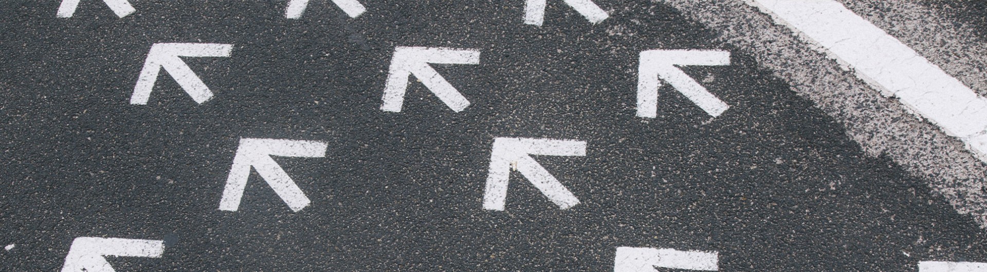 upward arrows on sidewalk