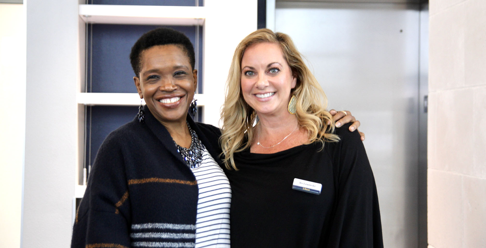 Two smiling female ubank employees